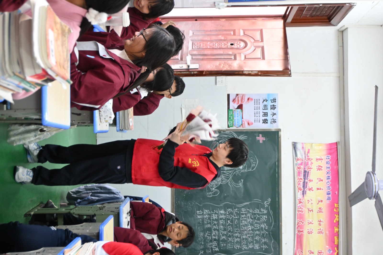 Volunteer helping with posters